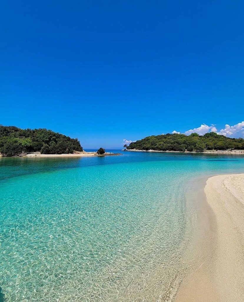 25 Best Places To Visit In Albania crystal clear waters and white sand of the beach of Ksamil